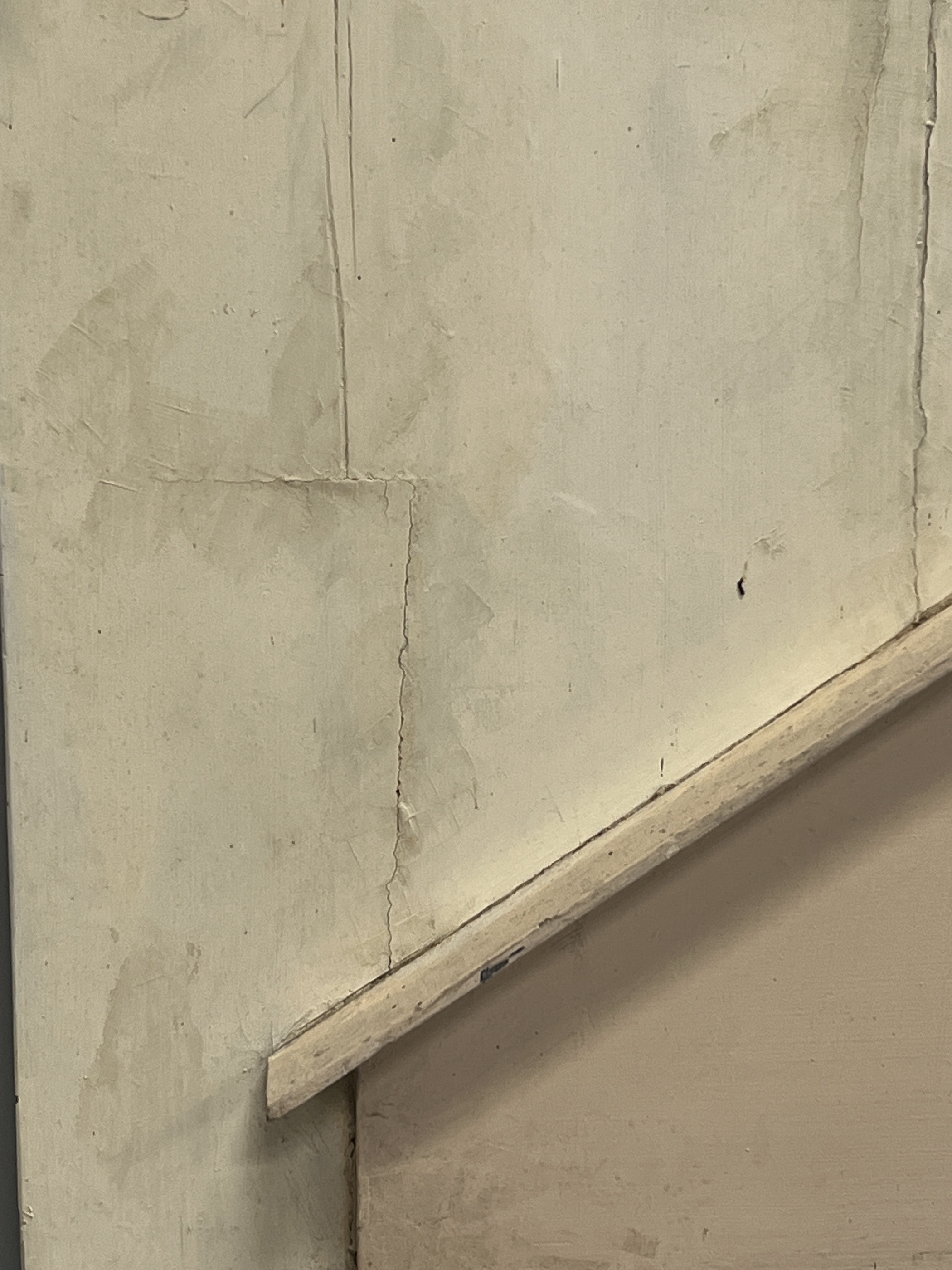 A late 18th/early 19th century French painted pine wall mirror modelled as an arched doorway, width 119cm, height 147cm